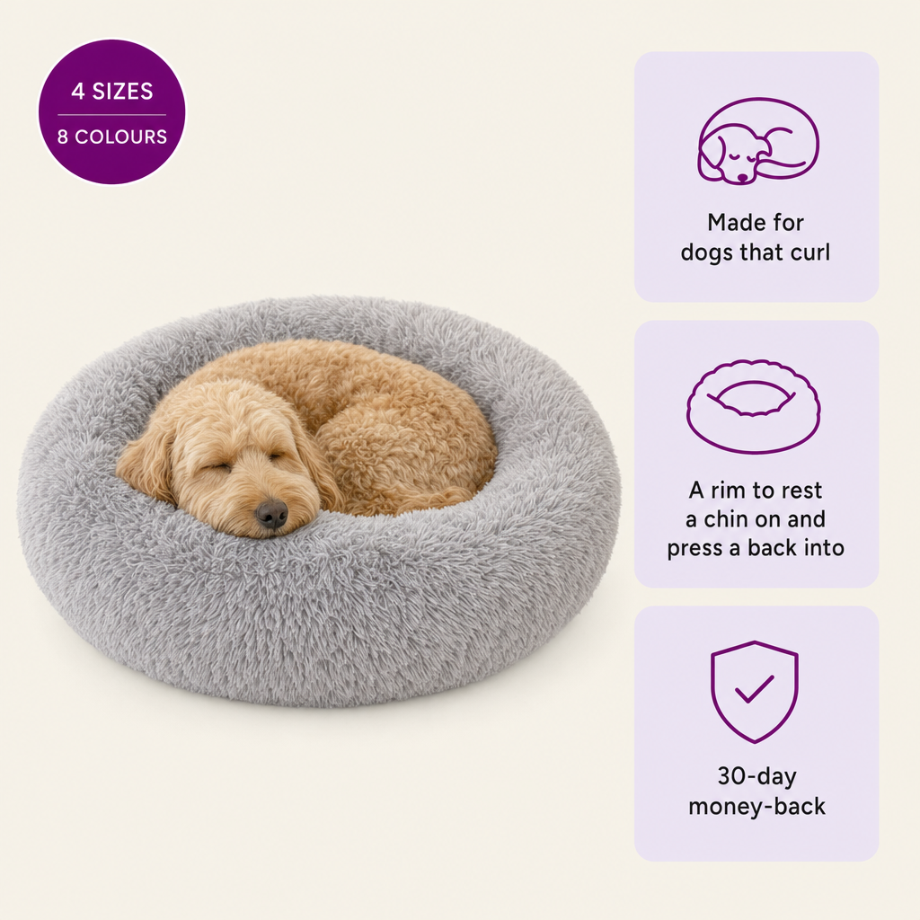 Bjaf Donut Dog Bed with a golden doodle curled up asleep inside. 4 sizes, 8 colours. Made for dogs that curl, a rim to rest a chin on, 30-day money-back.